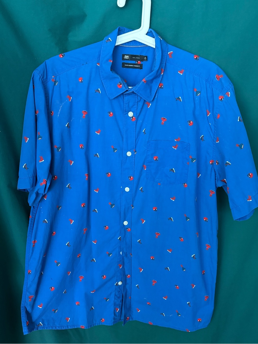Simons Royal Blue Short-Sleeve Button-Down Shirt with skates and football helmet